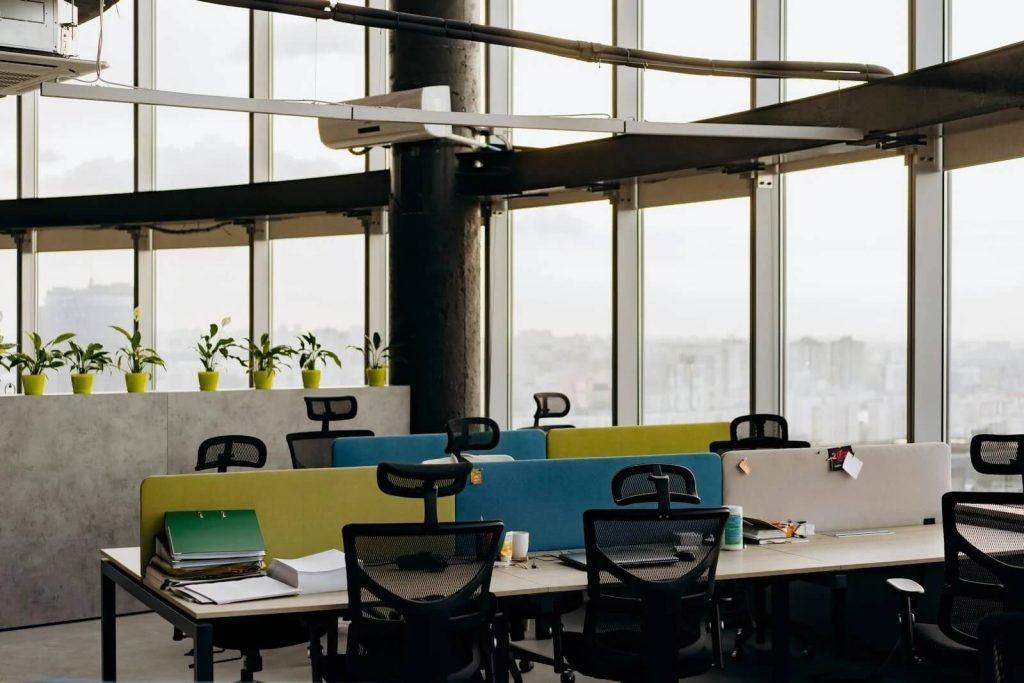 A clean, bright, modern office with desks and office chairs