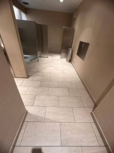 A clean tile floor in a public restroom