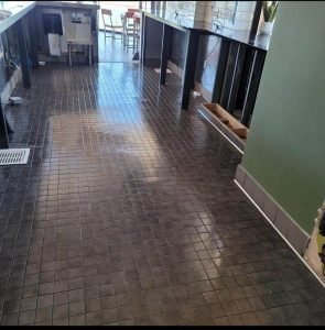 A gleaming tile behind a counter floor in a restaurant
