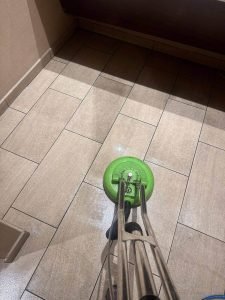 A floor being polished with a buffing machine