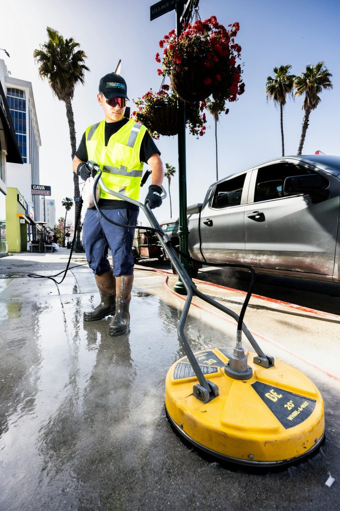 A man cleaning a sidewalk in San Francisco